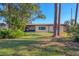 Large backyard featuring a home with screened porch at 6100 Green View Dr # 145, Sarasota, FL 34231