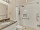 Updated bathroom with a walk-in shower and granite vanity at 6100 Greenview Dr # 145, Sarasota, FL 34231