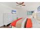 Bright bedroom with king-size bed and double dresser at 6100 Greenview Dr # 145, Sarasota, FL 34231