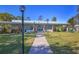 Community building with walkway and landscaping at 6100 Greenview Dr # 145, Sarasota, FL 34231