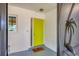 Inviting front entry with a bright yellow door at 6100 Greenview Dr # 145, Sarasota, FL 34231