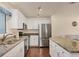 Modern kitchen with stainless steel appliances and granite countertops at 6100 Greenview Dr # 145, Sarasota, FL 34231