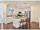 Modern kitchen with white cabinets, granite counters, and island at 6100 Greenview Dr # 145, Sarasota, FL 34231