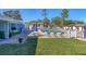 Community pool with lounge chairs and patio tables at 6100 Green View Dr # 145, Sarasota, FL 34231