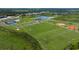 Aerial view of community with sports fields at 9153 Radiant Cir, Sarasota, FL 34241