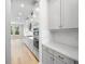 Modern kitchen with gray cabinets and white countertops at 9153 Radiant Cir, Sarasota, FL 34241