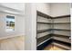 Walk-in pantry with dark wood shelving at 9153 Radiant Cir, Sarasota, FL 34241