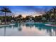 Resort-style pool with lounge chairs and sunset view at 9153 Radiant Cir, Sarasota, FL 34241