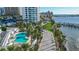 Stunning aerial view showcasing the community's waterfront location and pool at 988 Blvd Of The Arts # 915, Sarasota, FL 34236