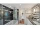 Modern bathroom with dark tile and granite countertops at 988 Blvd Of The Arts # 915, Sarasota, FL 34236