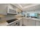 Modern kitchen with granite countertops and updated appliances at 988 Blvd Of The Arts # 915, Sarasota, FL 34236