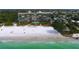 Beachfront property aerial view, showing the building and beach at 19 Whispering Sands Dr # 1204, Sarasota, FL 34242