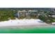 Stunning aerial view of beachfront property with ocean and city views at 19 Whispering Sands Dr # 1204, Sarasota, FL 34242