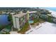 Beachfront property with pool and lush landscaping at 19 Whispering Sands Dr # 1204, Sarasota, FL 34242