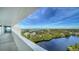 Stunning panoramic view of the ocean and lush landscape from private balcony at 19 Whispering Sands Dr # 1204, Sarasota, FL 34242