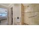 Clean bathroom with walk-in shower and pebble floor at 19 Whispering Sands Dr # 1204, Sarasota, FL 34242