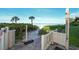 Private beach access with a gate and outdoor shower at 19 Whispering Sands Dr # 1204, Sarasota, FL 34242