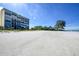 Stunning beachfront view showcasing the building and ocean at 19 Whispering Sands Dr # 1204, Sarasota, FL 34242
