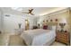 Bright bedroom with ensuite bathroom access and hardwood floors at 19 Whispering Sands Dr # 1204, Sarasota, FL 34242