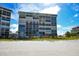 Exterior of beachfront building with balconies at 19 Whispering Sands Dr # 1204, Sarasota, FL 34242