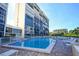 Refreshing community pool with ample lounge chairs for relaxation at 19 Whispering Sands Dr # 1204, Sarasota, FL 34242