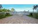 Refreshing community pool with ocean view, surrounded by lush tropical landscaping at 19 Whispering Sands Dr # 1204, Sarasota, FL 34242