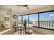 Ocean view dining area with glass table and comfortable seating at 19 Whispering Sands Dr # 1204, Sarasota, FL 34242