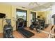 Modern fitness center equipped with treadmills and exercise bikes at 19 Whispering Sands Dr # 1204, Sarasota, FL 34242