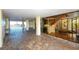 Indoor stairwell with glass walls and wood railings, providing natural light at 19 Whispering Sands Dr # 1204, Sarasota, FL 34242