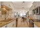 Open concept kitchen with granite countertops and stainless steel appliances at 19 Whispering Sands Dr # 1204, Sarasota, FL 34242