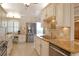 Modern kitchen features stainless steel appliances and granite countertops at 19 Whispering Sands Dr # 1204, Sarasota, FL 34242
