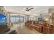 Spacious living room with leather couches and ocean views at 19 Whispering Sands Dr # 1204, Sarasota, FL 34242