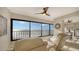 Relaxing living room boasts stunning ocean views from expansive windows at 19 Whispering Sands Dr # 1204, Sarasota, FL 34242