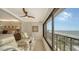 Bright living room with tiled floors, ceiling fan, comfortable chairs, and stunning ocean views at 19 Whispering Sands Dr # 1204, Sarasota, FL 34242