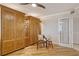 Comfortable office with built-in Murphy bed and sitting area at 19 Whispering Sands Dr # 1204, Sarasota, FL 34242