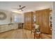 Home office with built-in cabinetry and wood wall unit at 19 Whispering Sands Dr # 1204, Sarasota, FL 34242