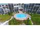 Hexagon-shaped pool with plenty of lounge chairs at 19 Whispering Sands Dr # 1204, Sarasota, FL 34242