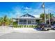 Modern restaurant with outdoor seating and landscaping at 19 Whispering Sands Dr # 1204, Sarasota, FL 34242
