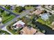 High-angle view of a house near a waterway, showcasing its location at 2402 Palmetto St, Nokomis, FL 34275