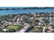Aerial view of waterfront home community with lush landscaping and canal access at 2402 Palmetto St, Nokomis, FL 34275