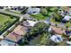 Aerial view of a house nestled amongst other homes near a canal at 2402 Palmetto St, Nokomis, FL 34275
