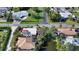 Aerial view of a house near a canal with neighboring houses visible at 2402 Palmetto St, Nokomis, FL 34275