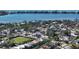 An aerial view of a home near the water, surrounded by other houses at 2402 Palmetto St, Nokomis, FL 34275