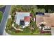 Aerial view showing a house with a pool and a canal in the background at 2402 Palmetto St, Nokomis, FL 34275
