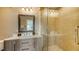 Bathroom with single vanity and walk-in shower at 2402 Palmetto St, Nokomis, FL 34275