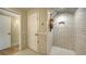 Walk-in shower with subway tile and hexagon floor tile at 2402 Palmetto St, Nokomis, FL 34275