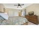 Bedroom with a king-size bed, dresser, and a view at 2402 Palmetto St, Nokomis, FL 34275