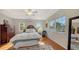 Bedroom with full bed, hardwood floors, and window views at 2402 Palmetto St, Nokomis, FL 34275