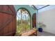 Charming courtyard with wooden shutters and a tranquil setting at 2402 Palmetto St, Nokomis, FL 34275