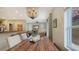 Bright dining room featuring a rustic wooden table and ample natural light at 2402 Palmetto St, Nokomis, FL 34275